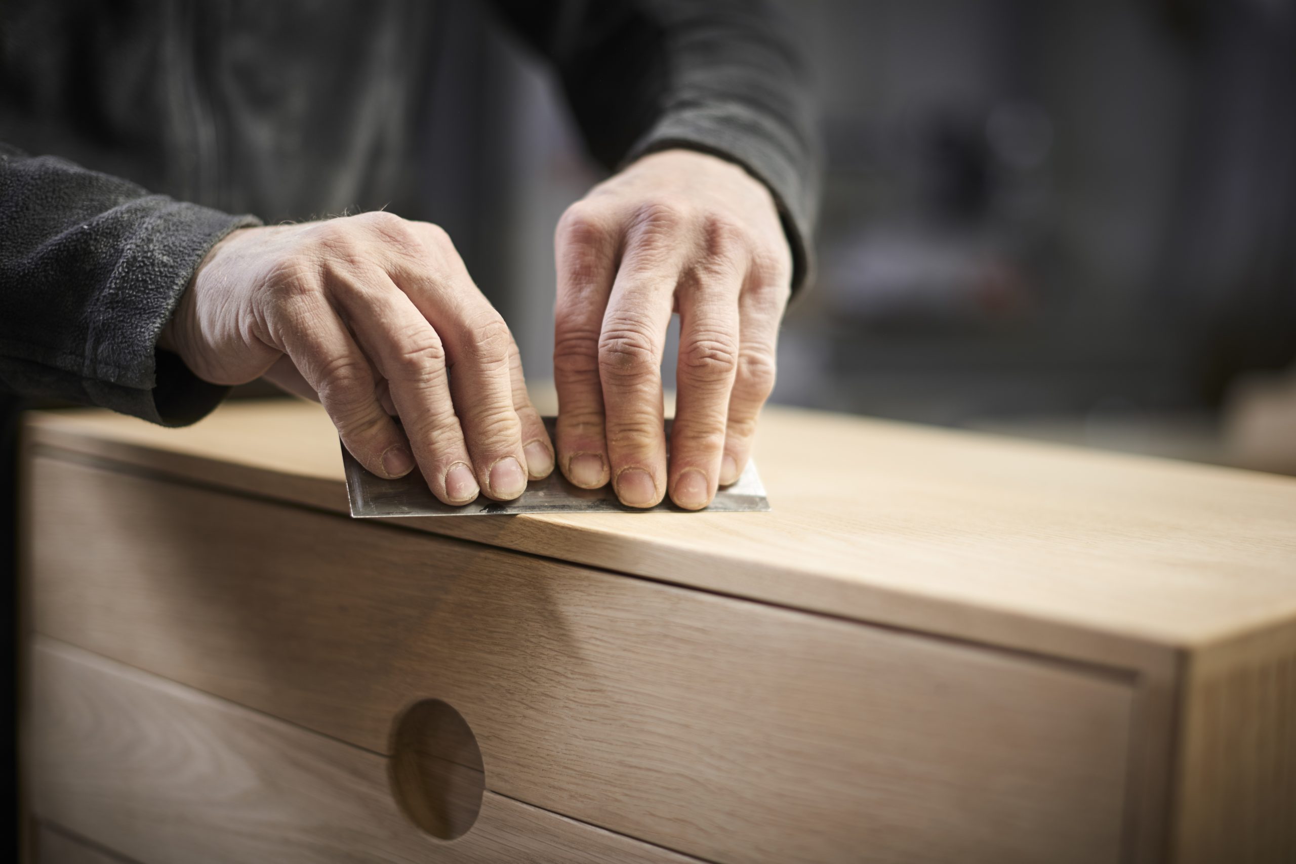 Scraping oak cabinet